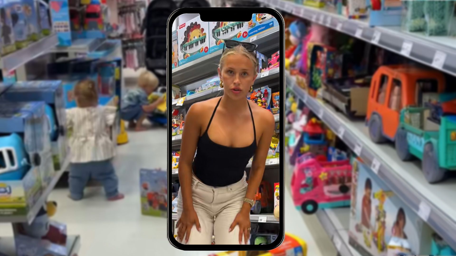 Aussie influencer Lauren Grap in Kmart toy aisle with two toddlers