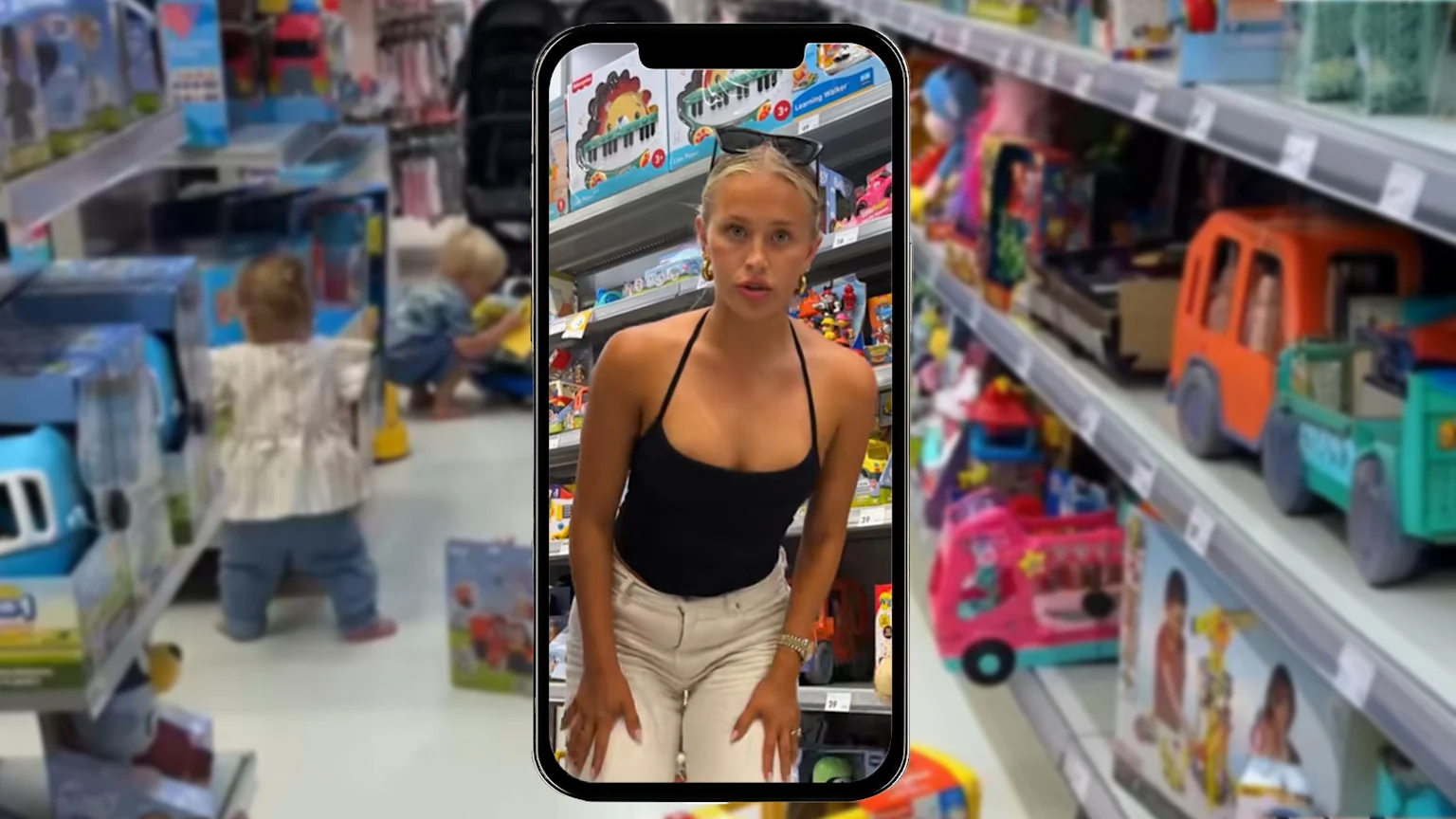 Aussie influencer Lauren Grap in Kmart toy aisle with two toddlers