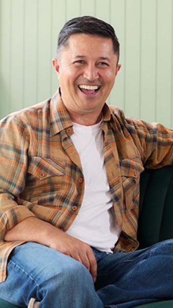 Mike Puru standing with trees in background
