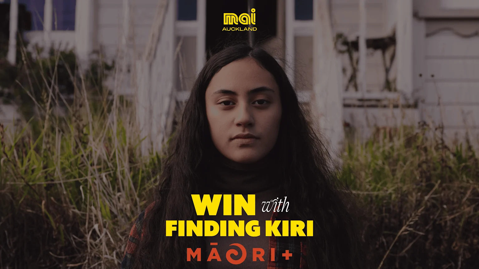 A young person with long dark hair stands in front of an old house and tall grass, with text "WIN with FINDING KIRI MĀORI+" and "mai AUCKLAND".