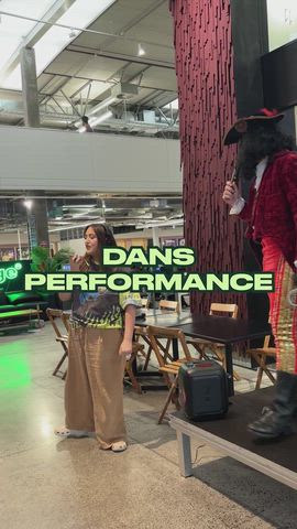 Dan performs in front of the office