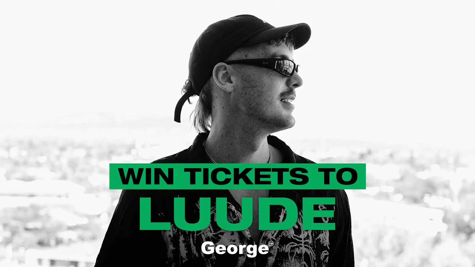 A man in a cap and sunglasses looks right, with overlaid green banners reading "WIN TICKETS TO LUUDE" and "George®" below.