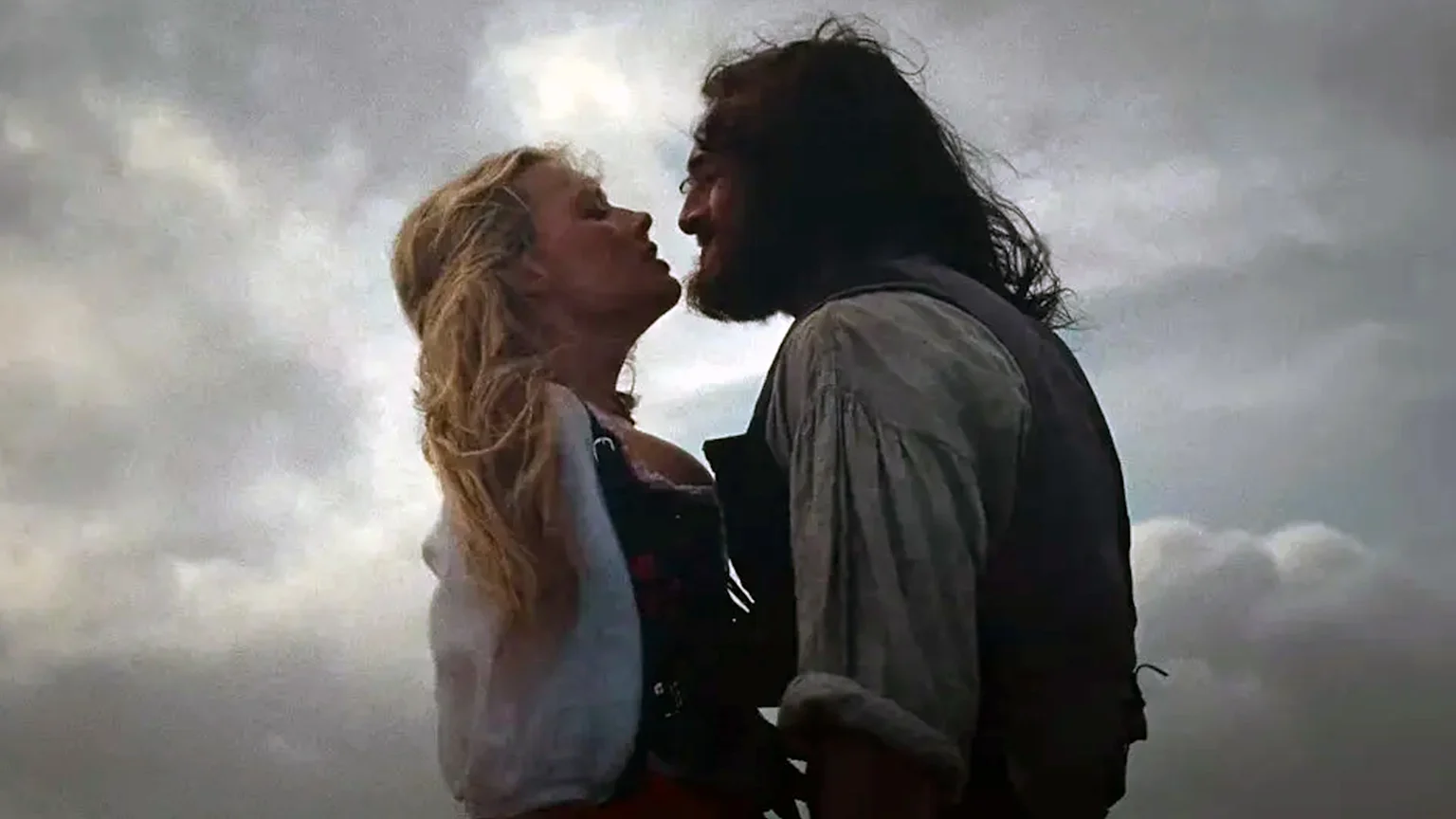 Margot Robbie and Jacob Elordi as characters Catherine and Heathcliff from 'Wuthering Heights' face to face, chest to chest appearing to almost kiss.