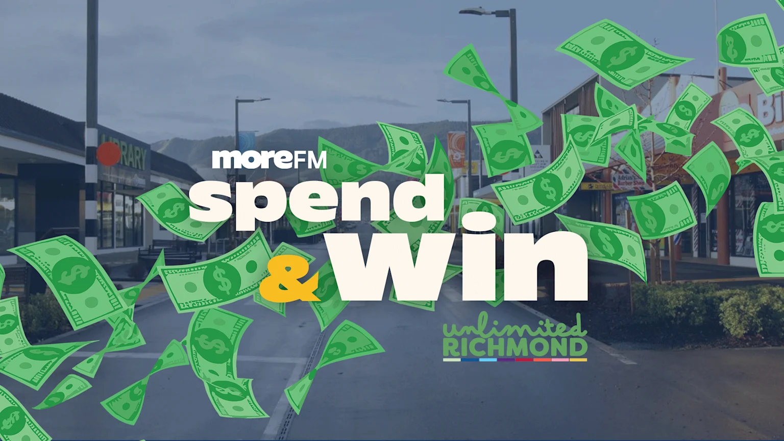 Green dollar bills fall across a street scene with buildings and mountains, overlaid with text "moreFM spend & Win unlimited RICHMOND".