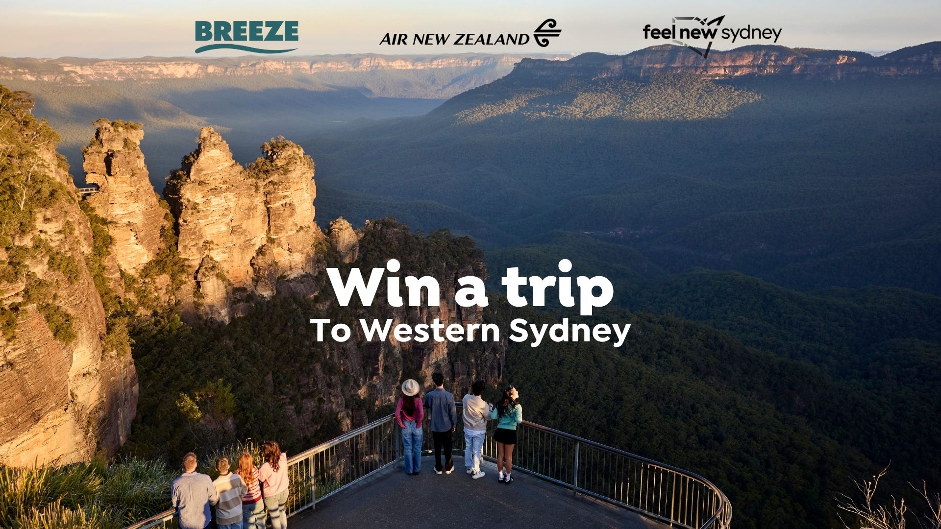 People on a lookout platform view the iconic Three Sisters rock formation of the Blue Mountains and forested valleys at sunset, with text "Win a trip To Western Sydney" and brand logos.