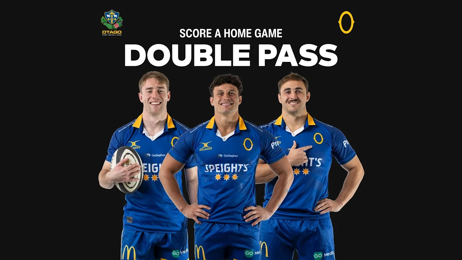 Three smiling male rugby players in blue and gold Otago Rugby uniforms stand in front of text that reads "SCORE A HOME GAME DOUBLE PASS," with the team logo visible.
