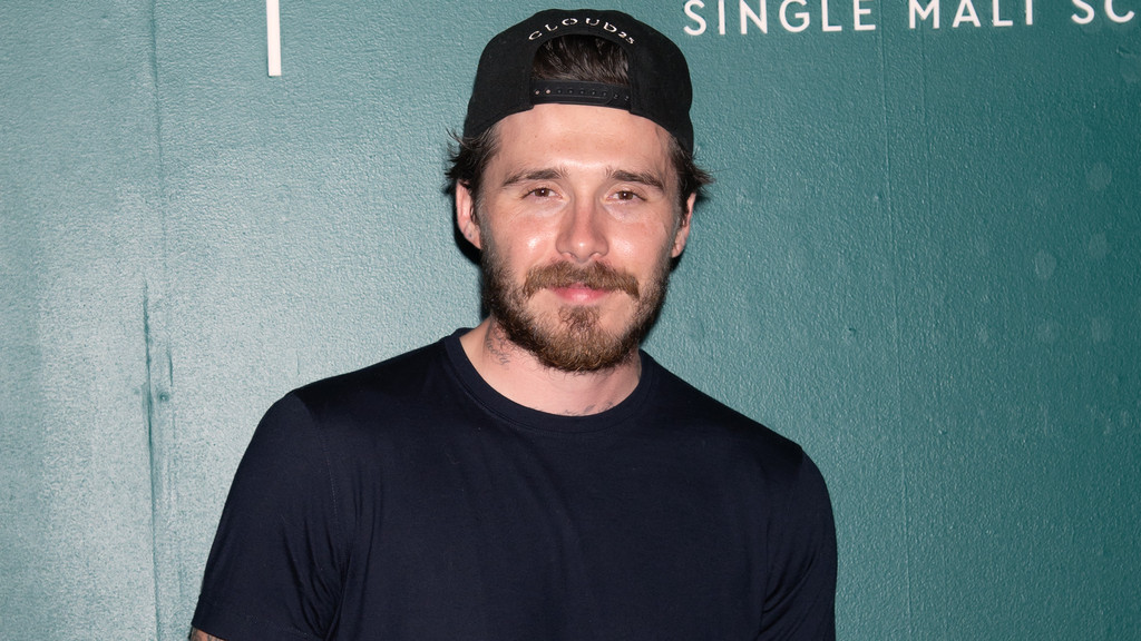 Brooklyn Beckham sets about erasing family tattoos