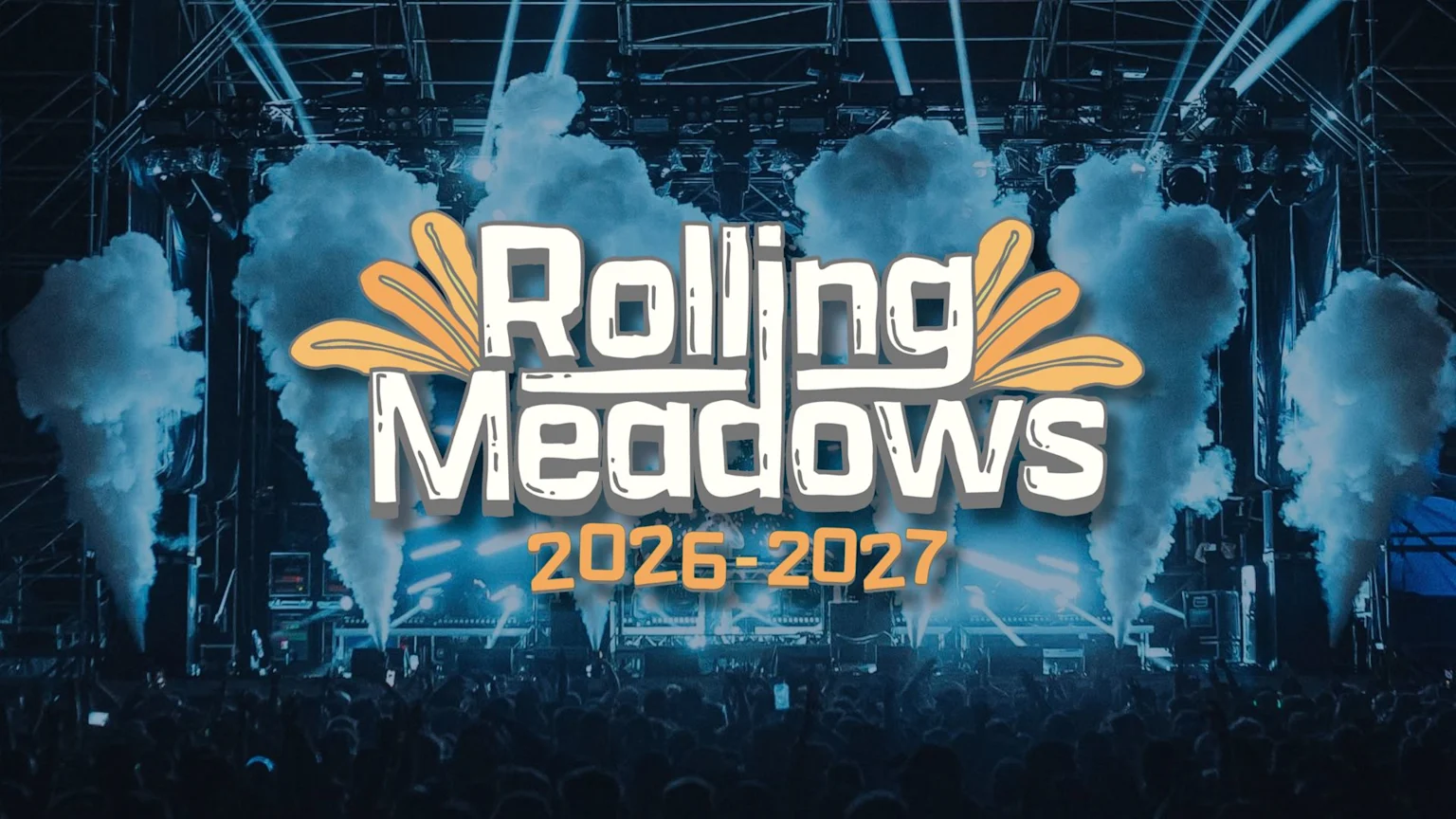 A concert stage with lights and smoke effects, a crowd, and a white and orange logo reading "Rolling Meadows 2026-2027" in the foreground.