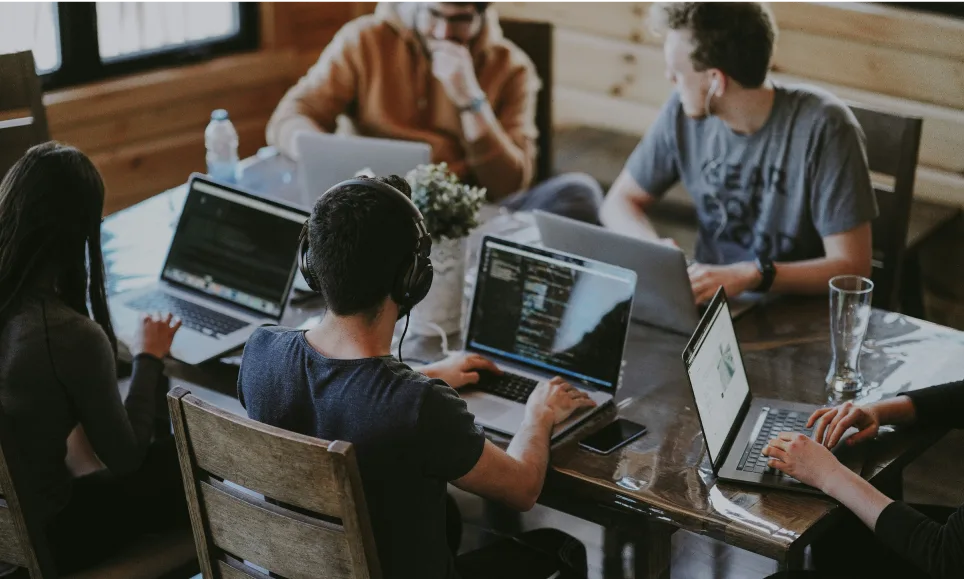 Photo of a dev team working together