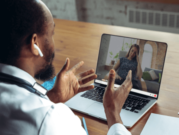 A healthcare professional doing a teleconference call with a patient