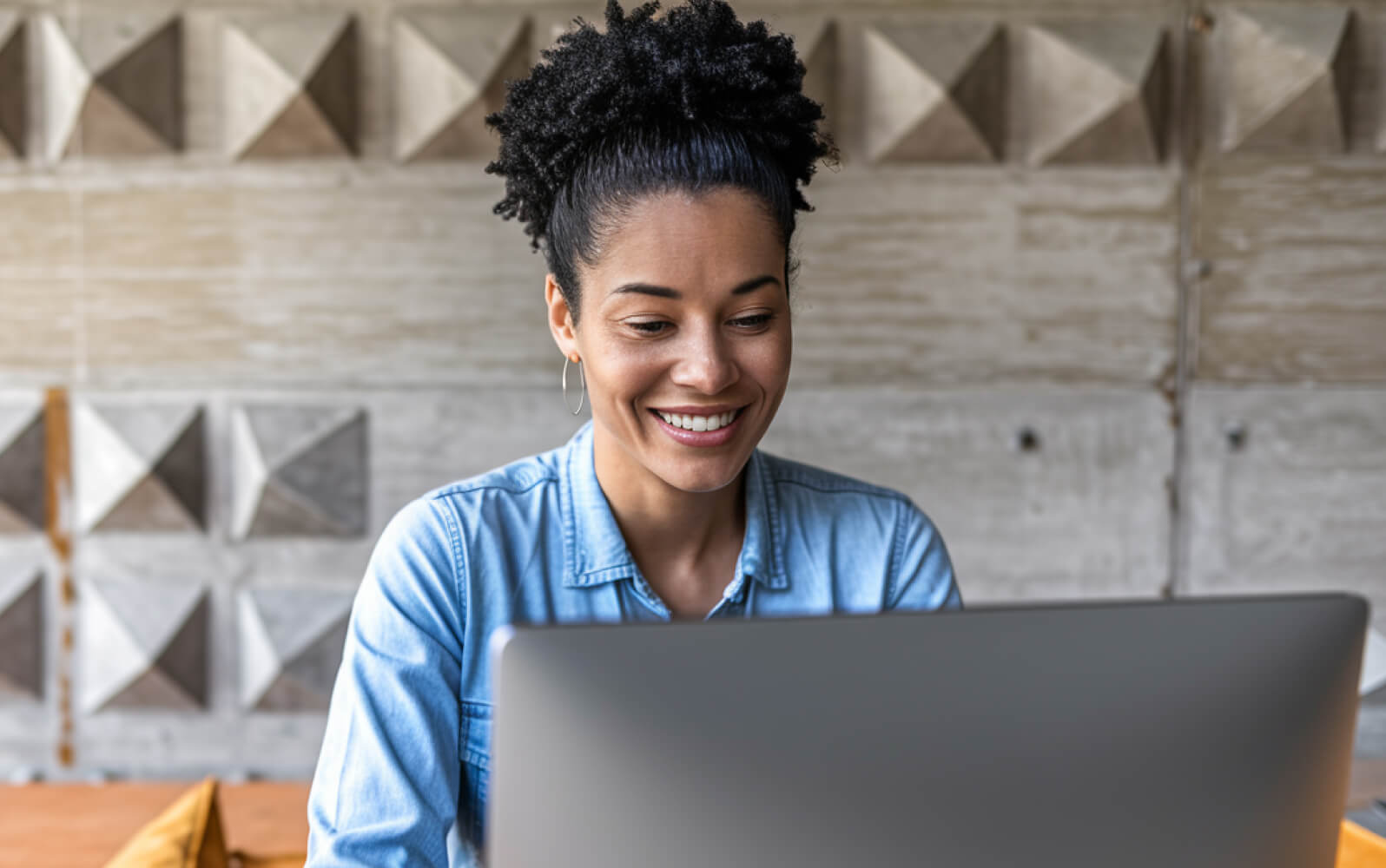 A woman working on a laptop