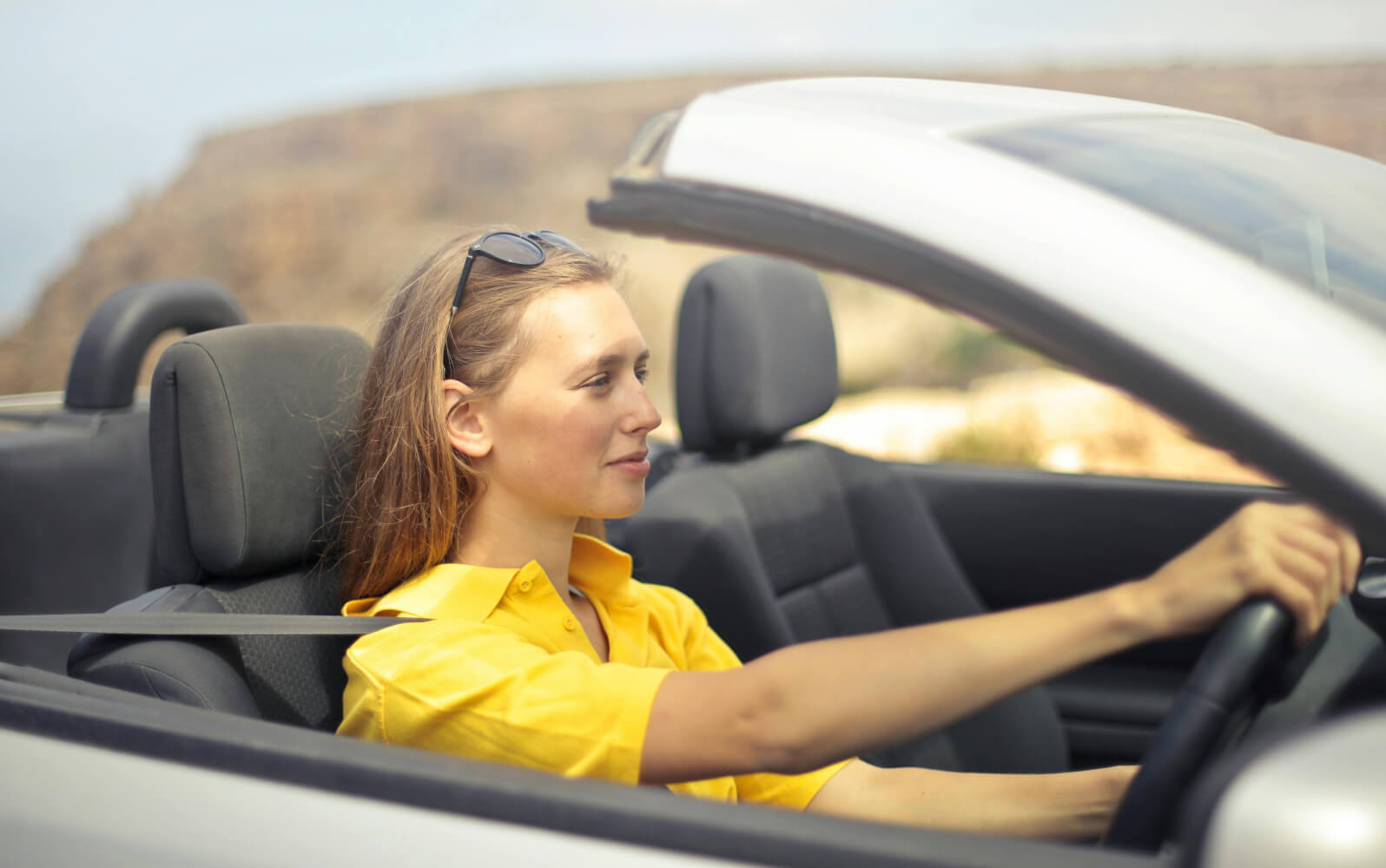 A woman driving a car