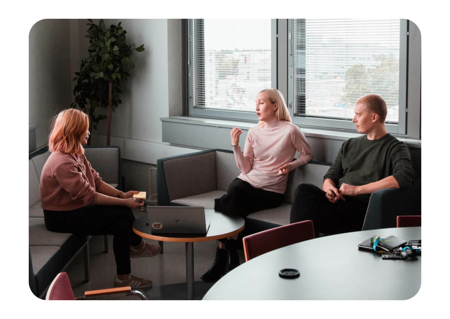 Three people discussing