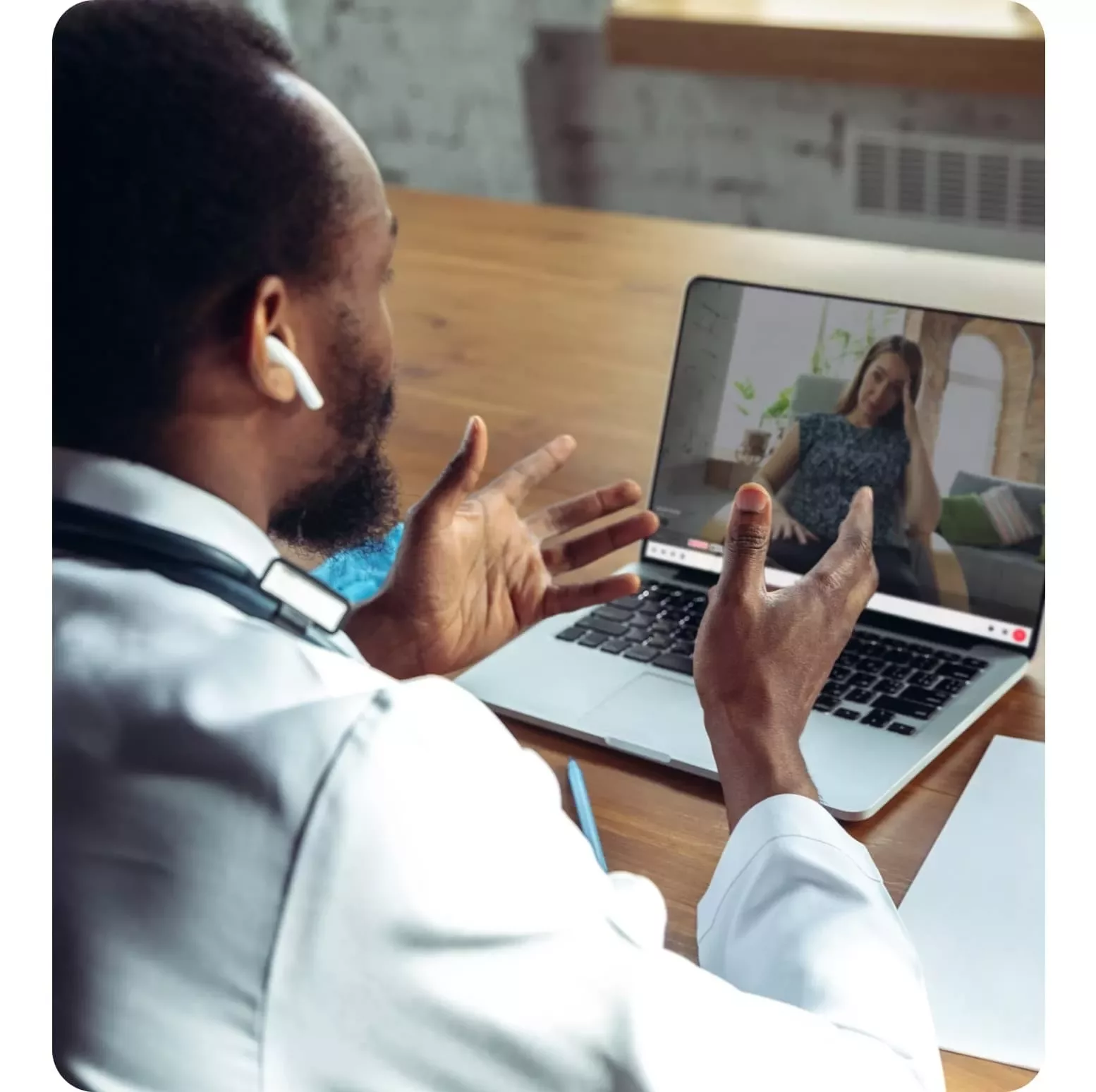 A healthcare professional meeting a patient virtually on his laptop