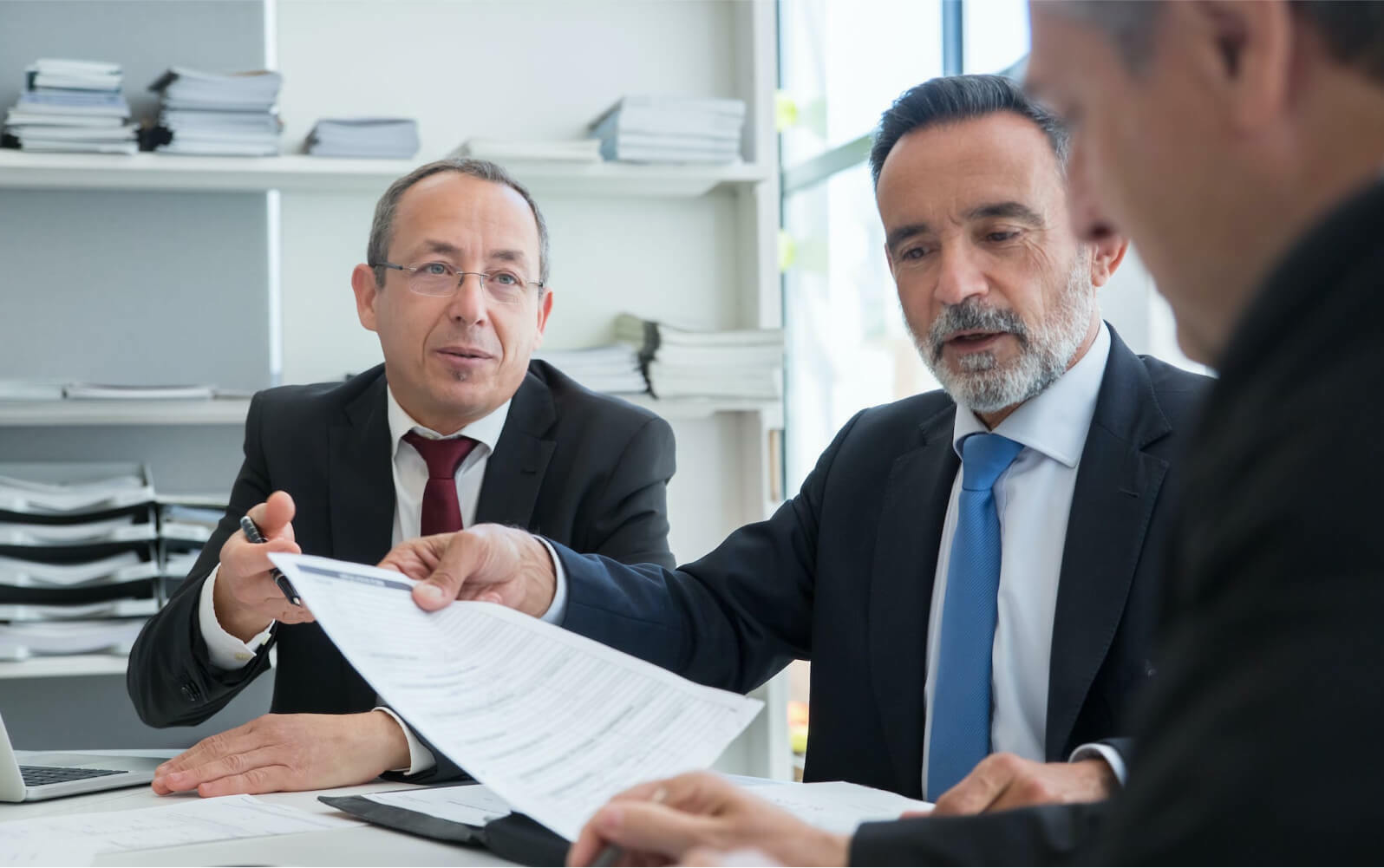 Three lawyers discussing