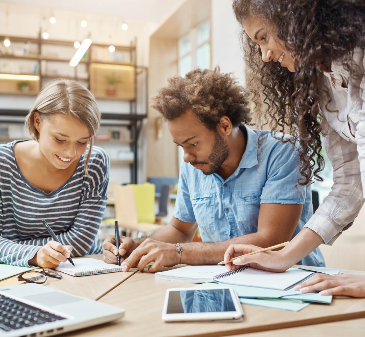 Three people working together