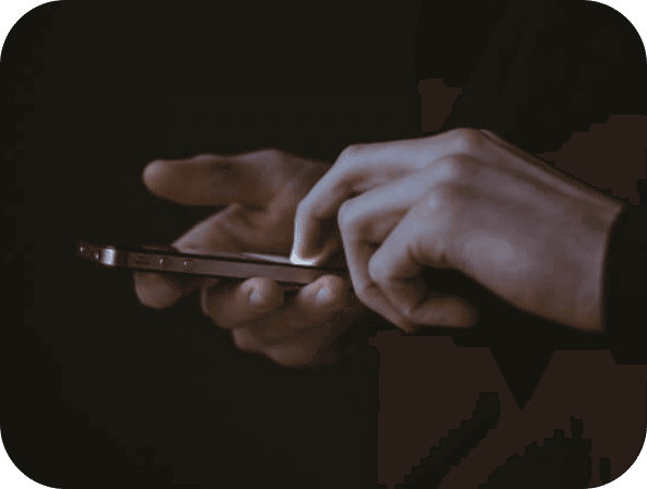 A hand holding a phone