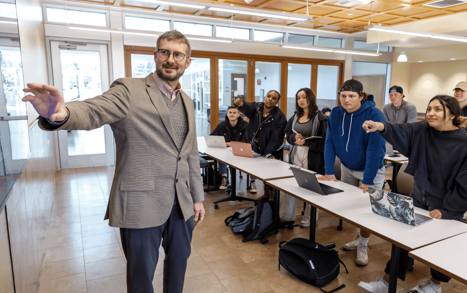 A professor with students having a discussion