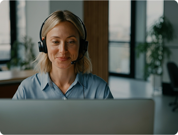 Image of a person in a contact center speaking to a customer and providing support