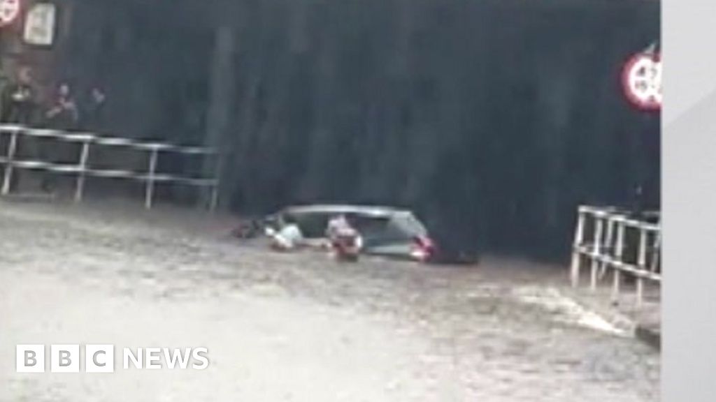 Sheffield floods: Passer-by pulls woman from partly submerged car