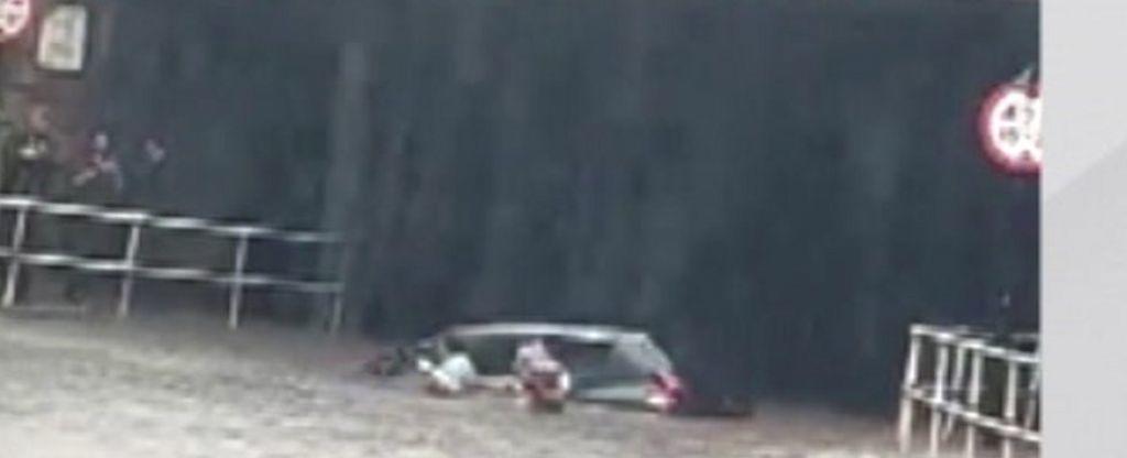 Sheffield floods: Passer-by pulls woman from partly submerged car