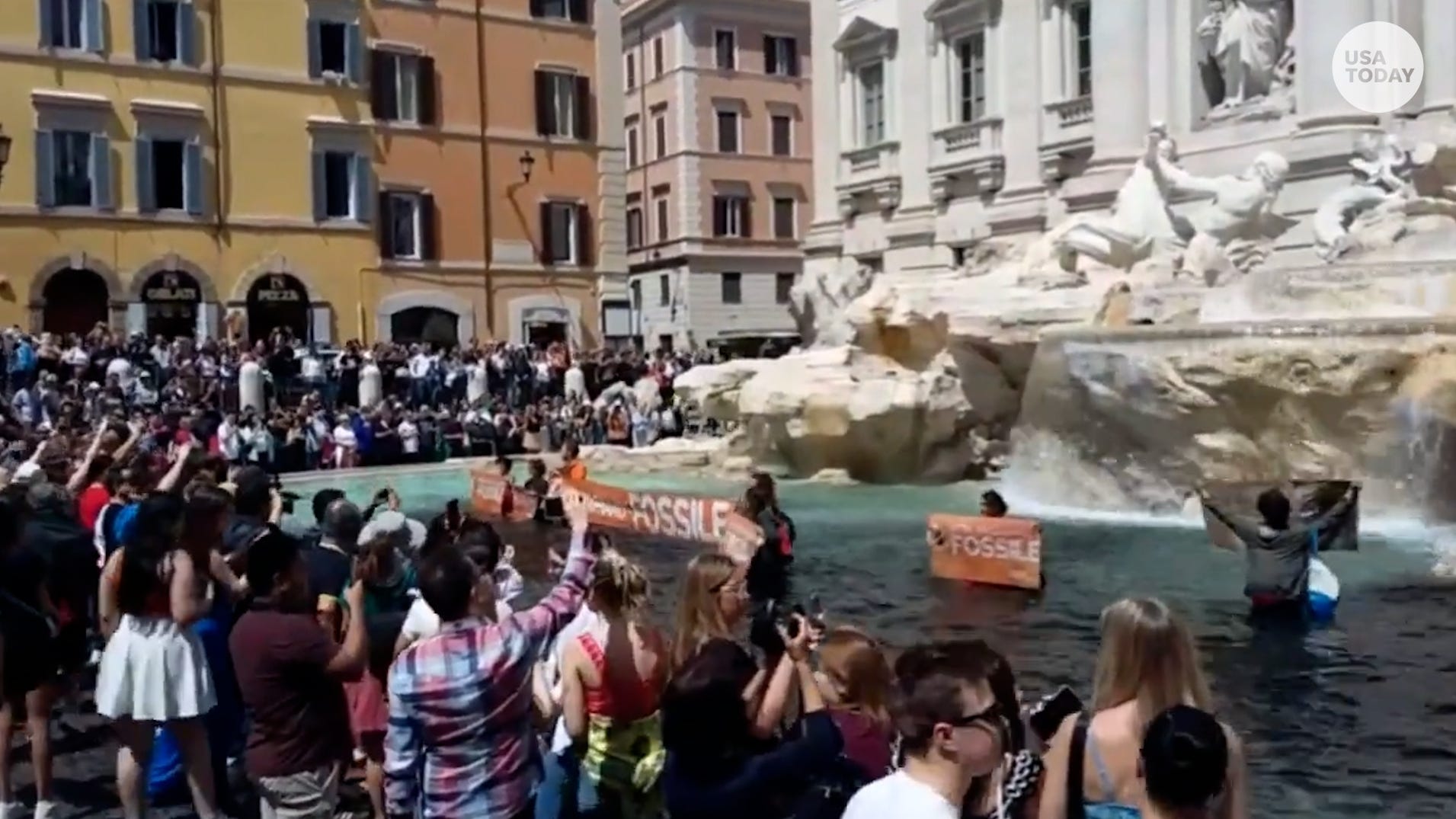 Climate protesters turn Trevi Fountain water black for deadly floods