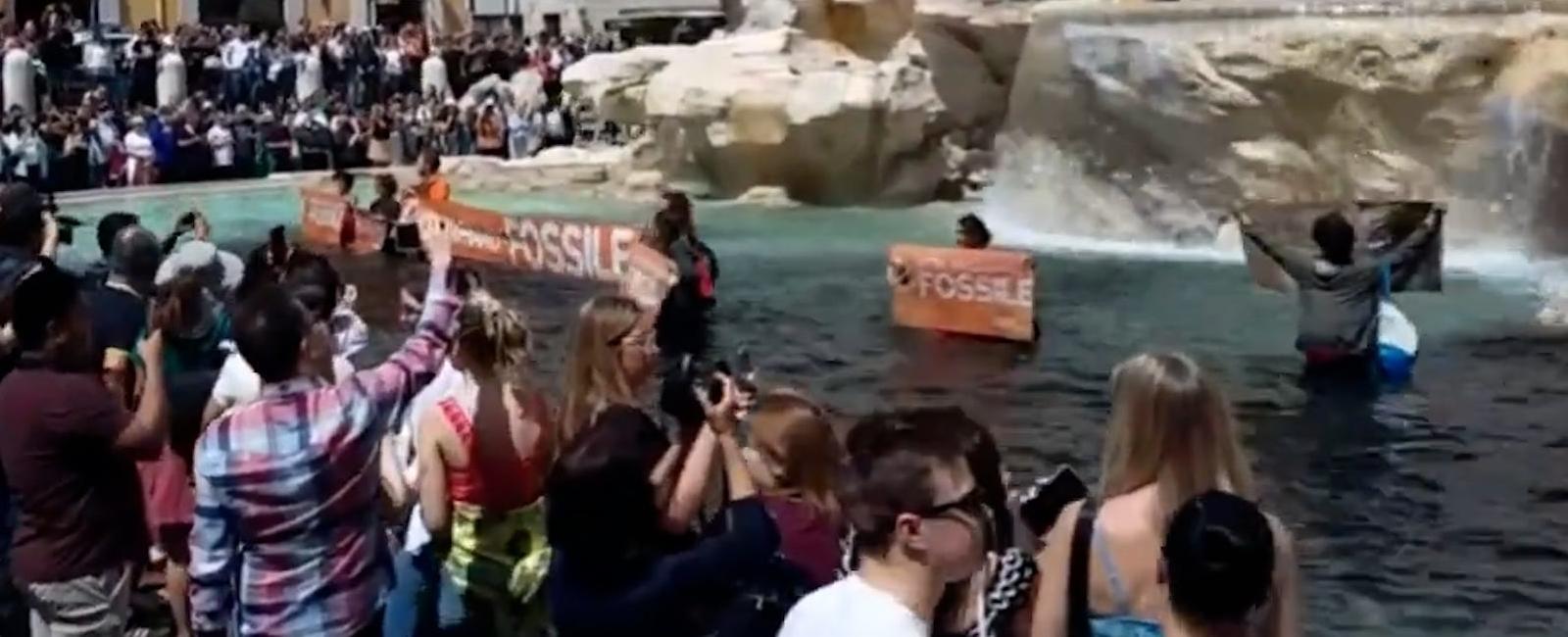 Climate protesters turn Trevi Fountain water black for deadly floods