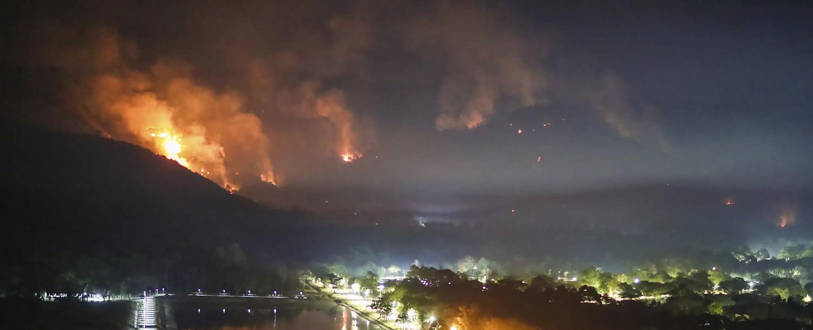 Thai authorities battle spread of mountain wildfires