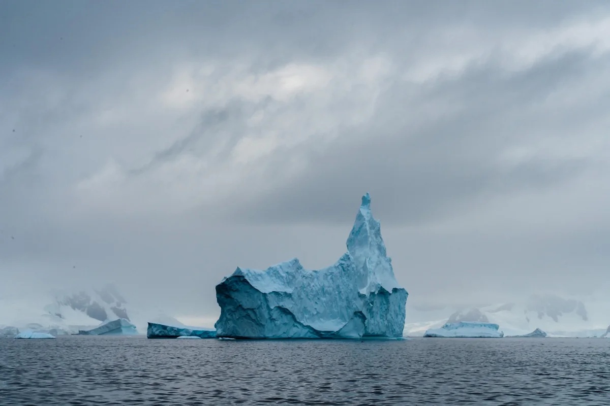 Alex-Krowiak-Antarctica-Photography-finger-from-distance