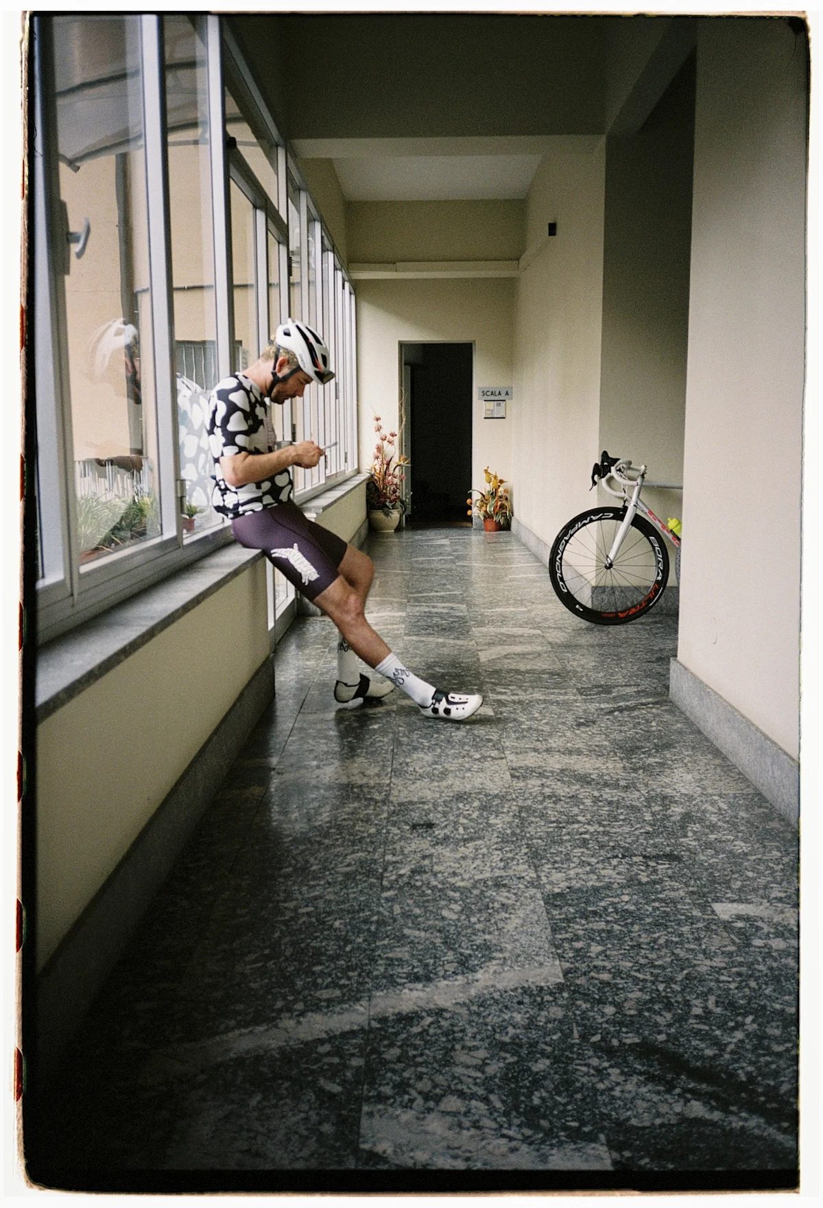team-dream-bicycling-team-tirano-pop-up-cyclist-in-hallway-vertical