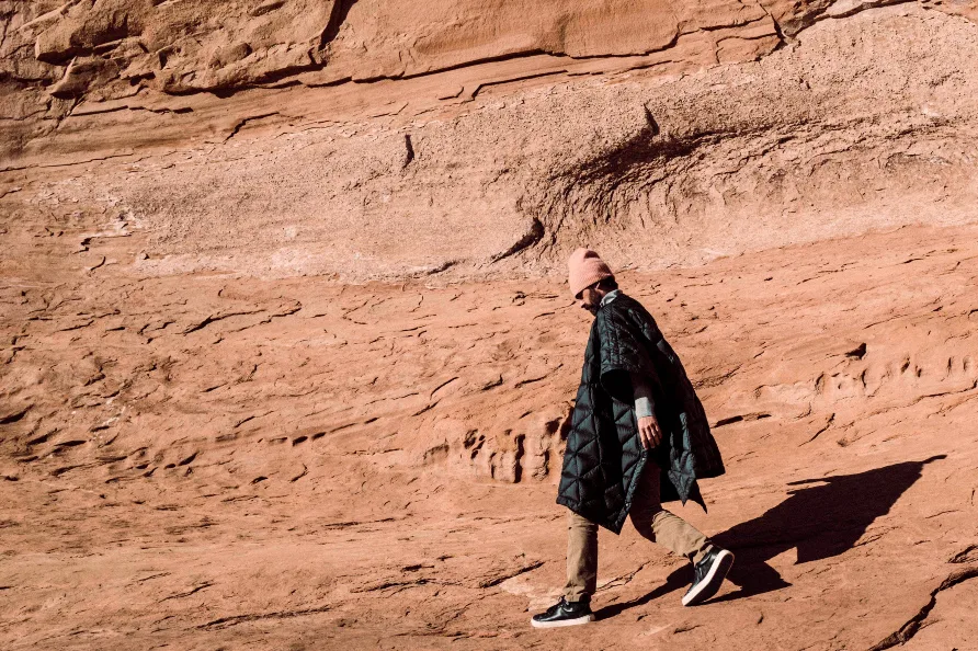 The AETHER Down Poncho Is a Perfect Campsite Companion