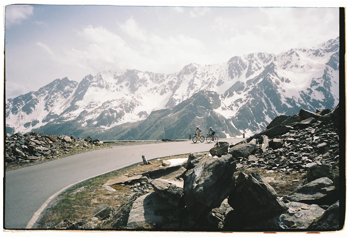 team-dream-bicycling-team-tirano-pop-up-cyclists-mountain-background