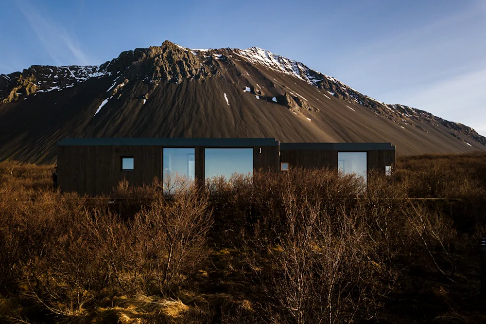 This Icelandic Prefab Cabin by Manta North Boasts Sea & Volcano Views