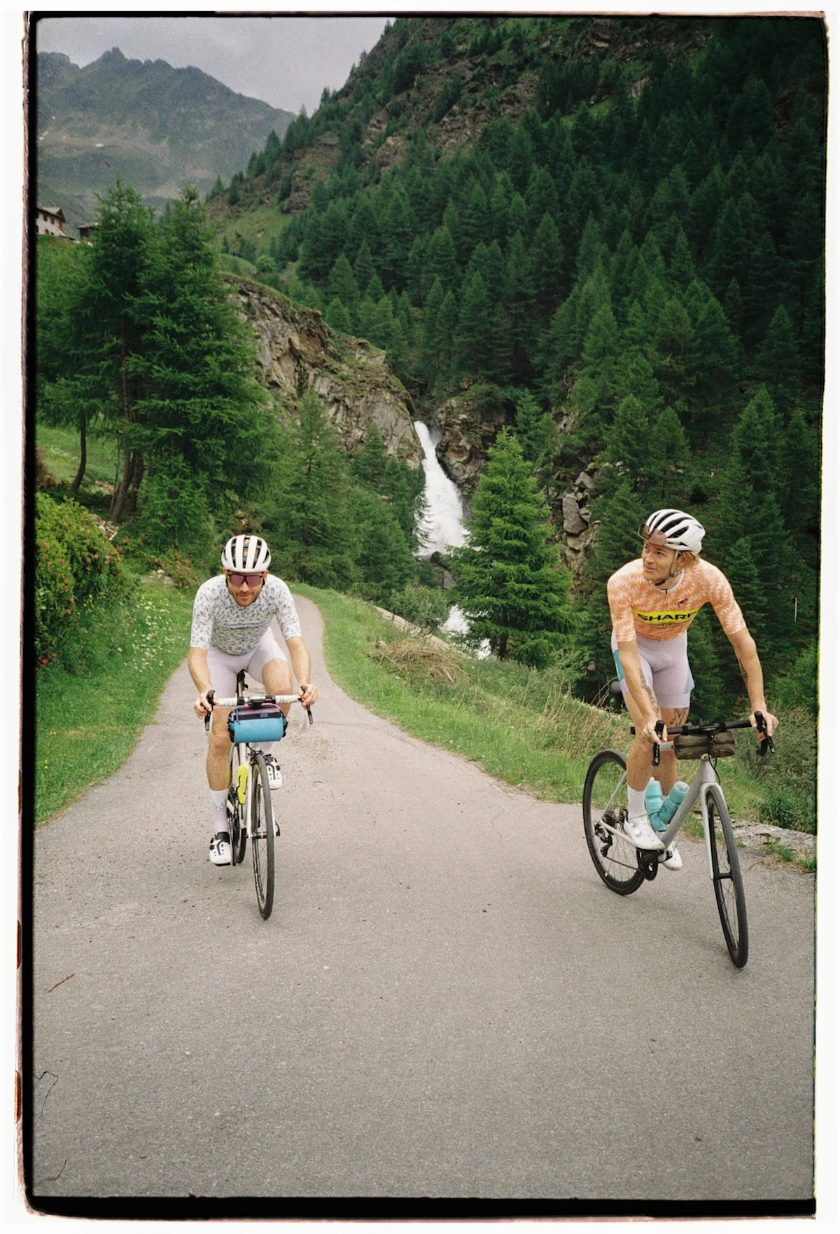 team-dream-bicycling-team-tirano-pop-up-pair-going-up-a-climb-vertical