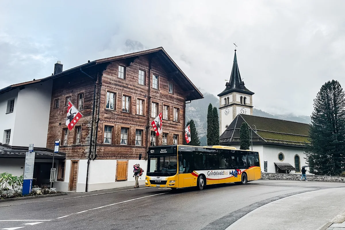 grindelwald-switzerland-hiking-guide-bus-in-front-of-building-horizontal