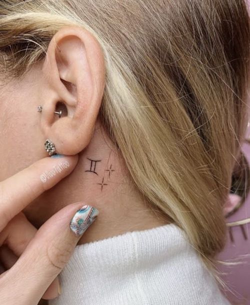 aries symbol tattoo behind ear