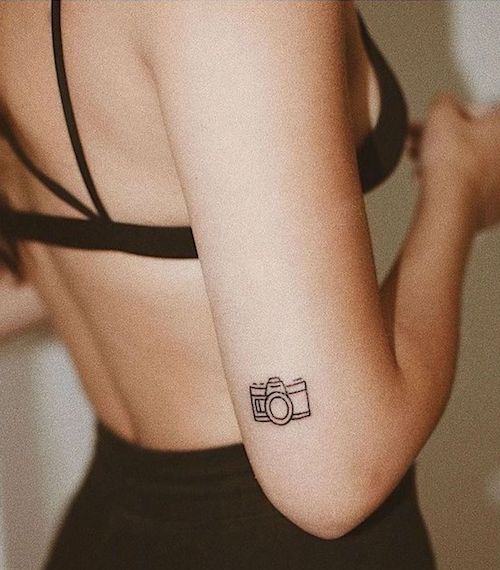 Minimalist black and white cassette player tattoo on the wrist on Craiyon