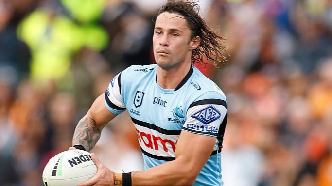 Nicho Hynes of the Sharks runs with the ball during the round eight NRL match between Wests Tigers and Cronulla Sharks at Leichhardt Oval, on April 27, 2025, in Sydney, Australia. 