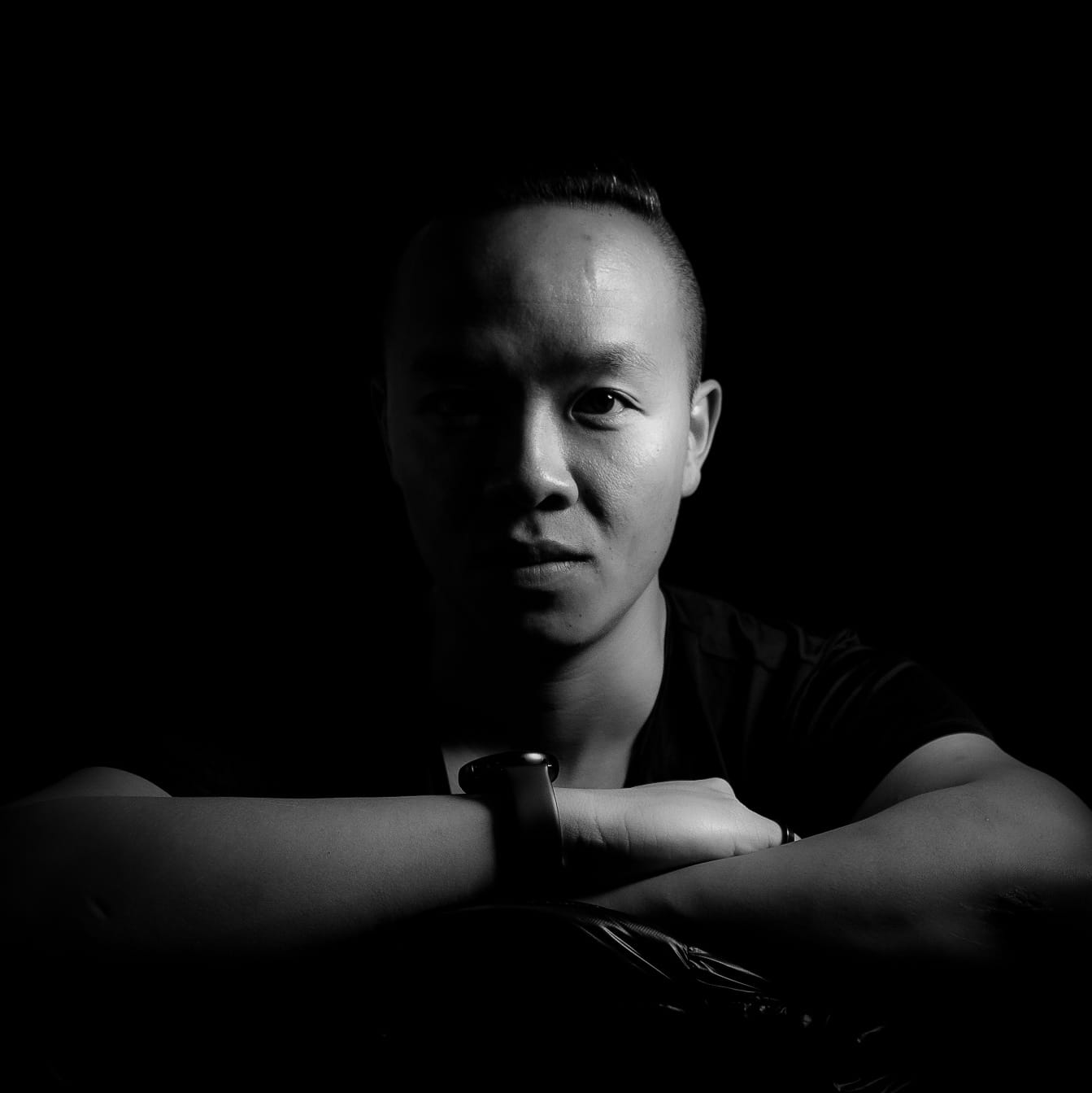 Dennis Tang's headshot image