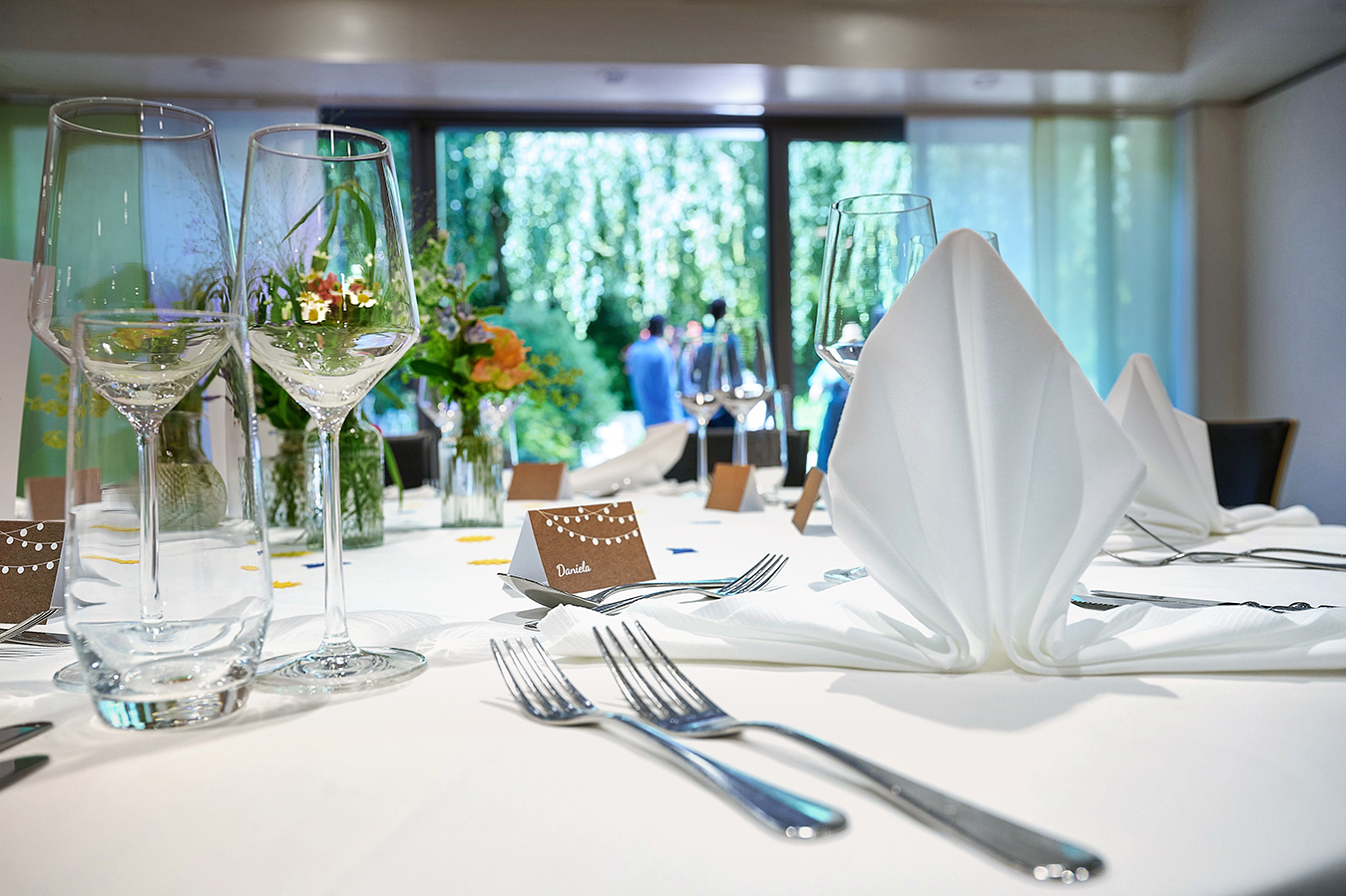 Decorated wedding hall with a view of the Seegarten restaurant terrace