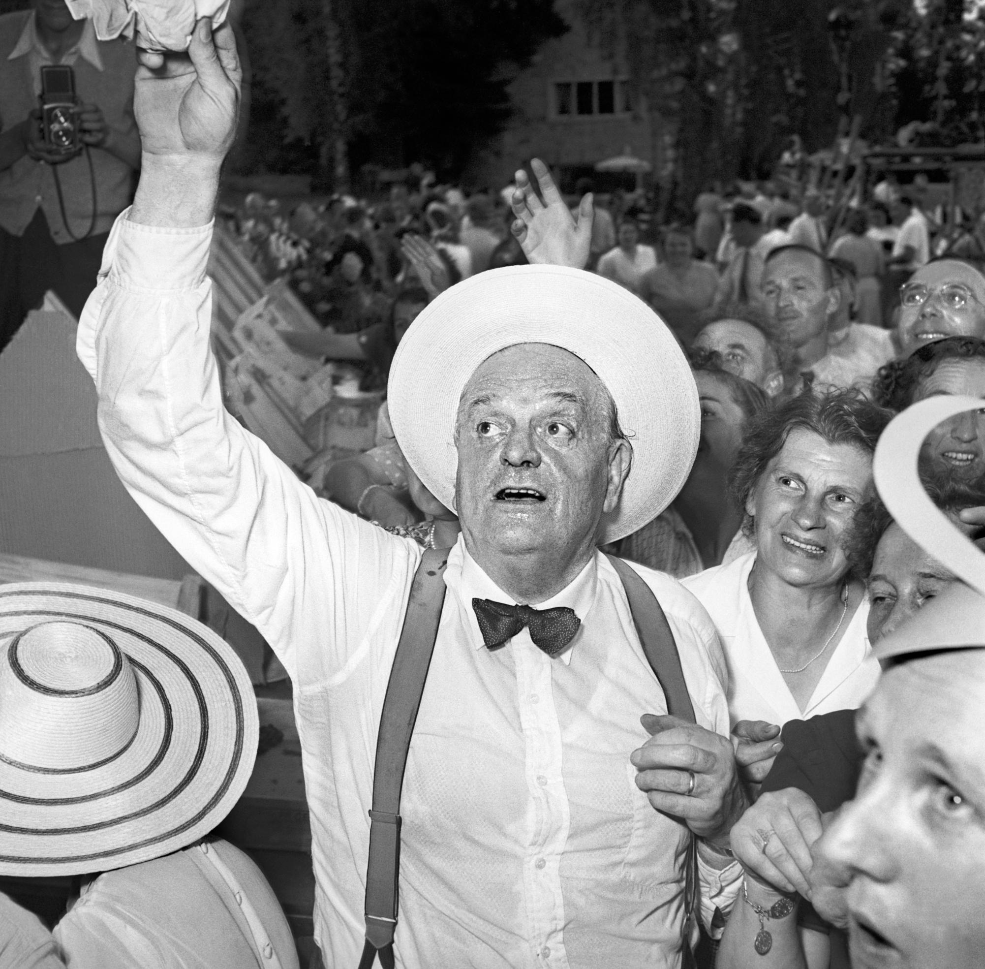 A black-and-white photograph of Gottlieb Duttweiler at the 25th anniversary celebrations