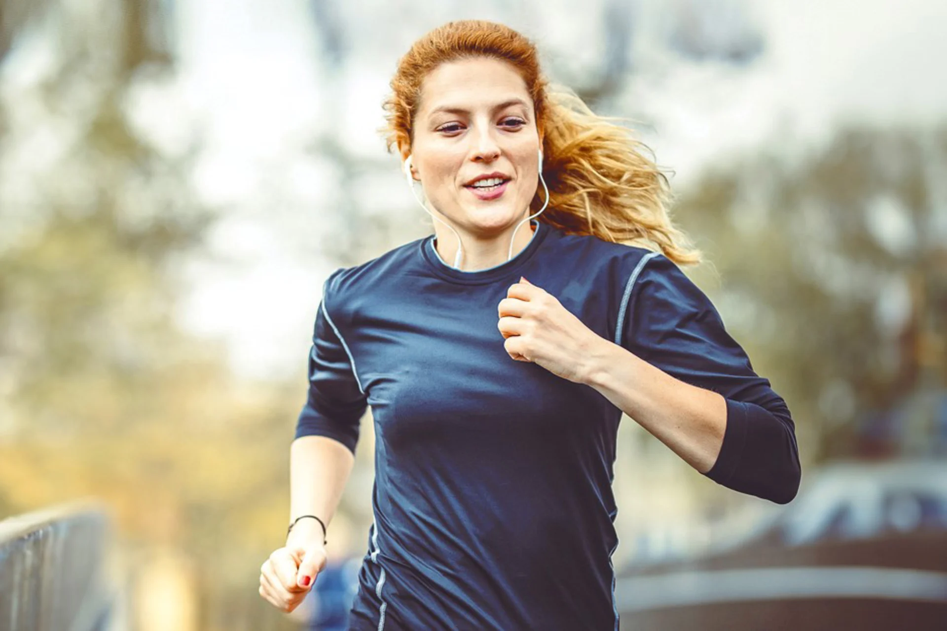 Woman with headphones jogging