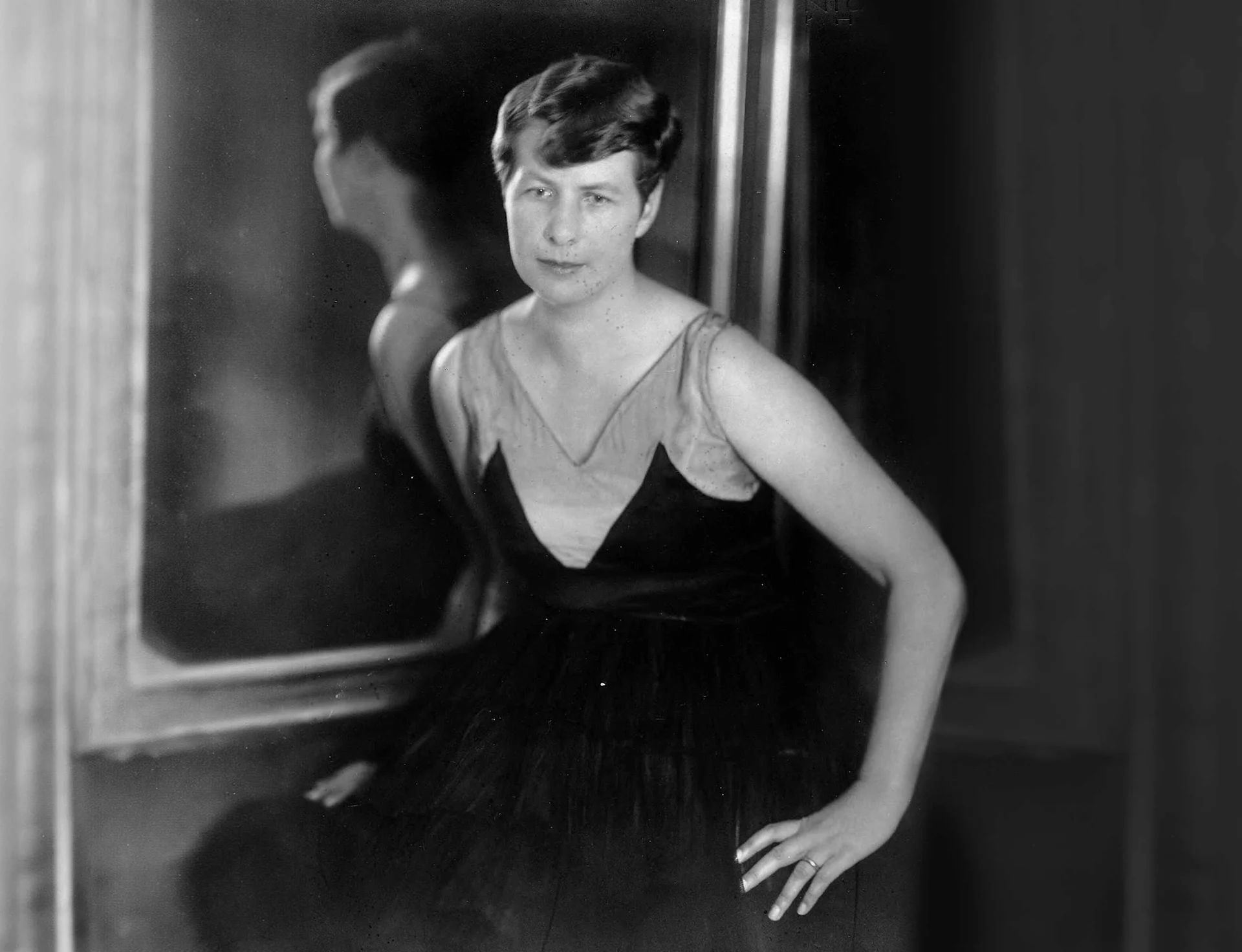 A black-and-white photograph of the young Adele Duttweiler in an evening dress.