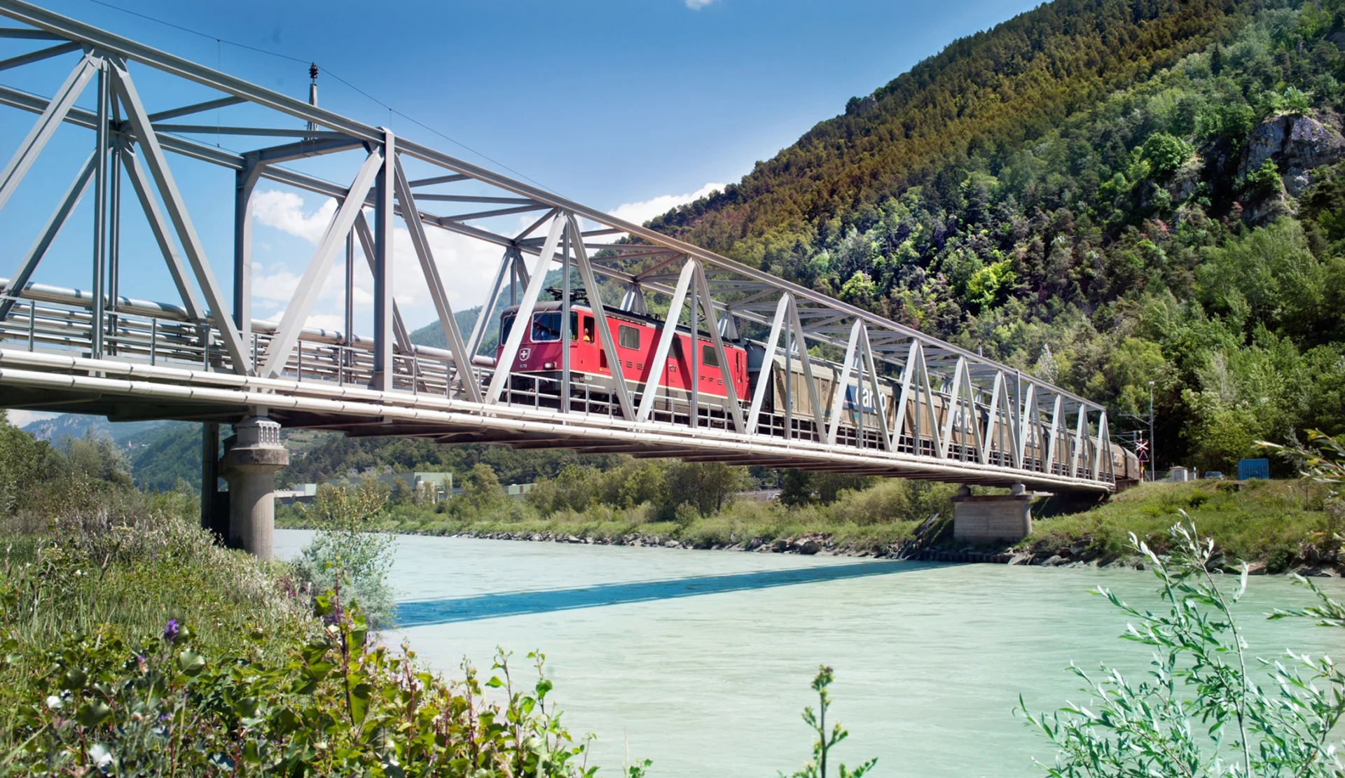 An SBB train going over a bridge.