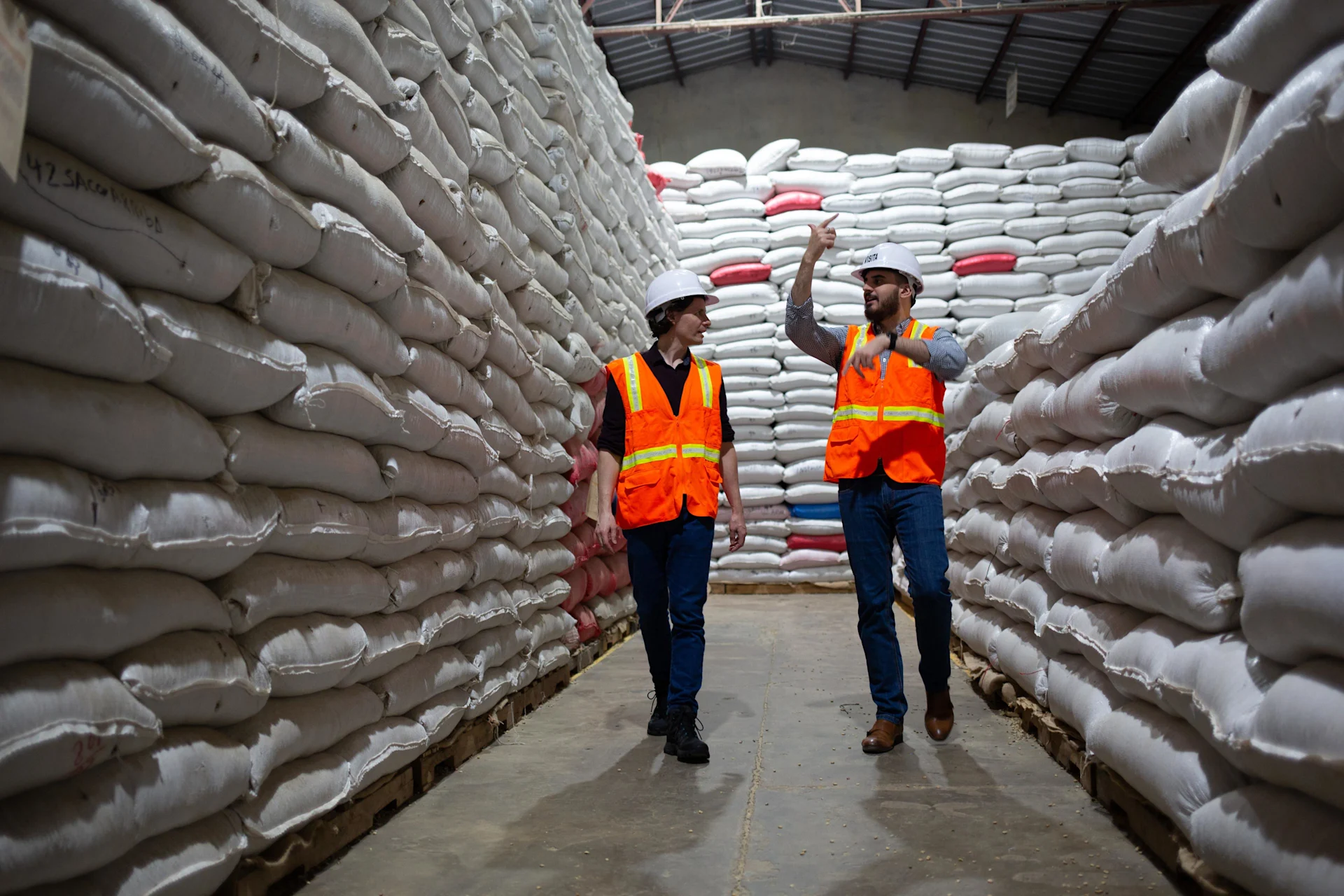 Simon Aebi from Max Havelaar Switzerland (left) visits Molinos coffee warehouse