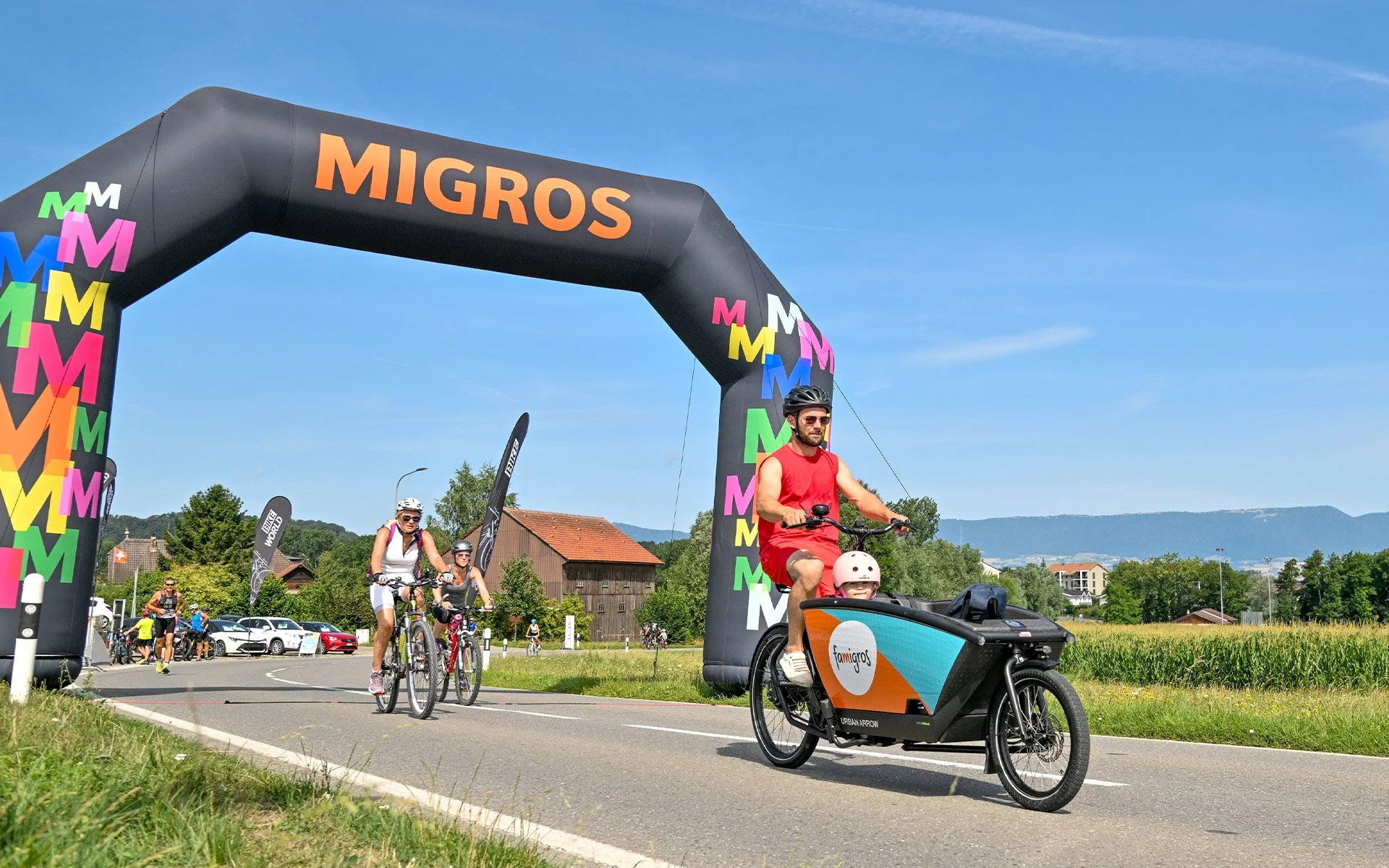A father with a child on a transport bike takes part in the slowUp
