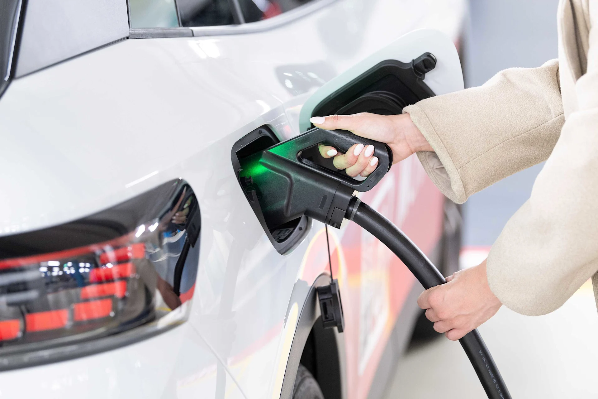 A vehicle is charged at a Migrol charging station (M-Charge).
