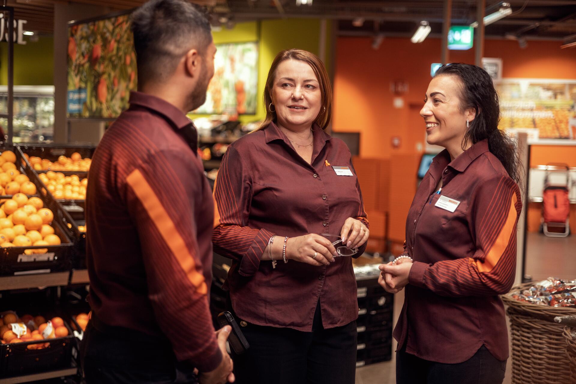 Employees in a Migros supermarket