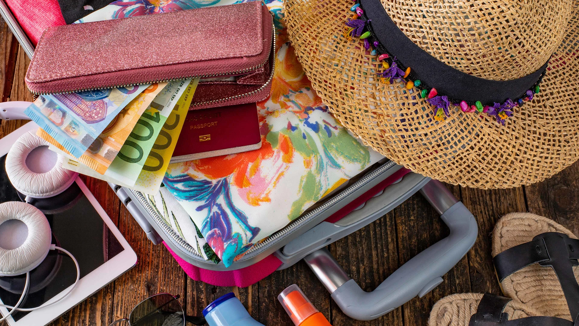 Travel items are packed in the suitcase