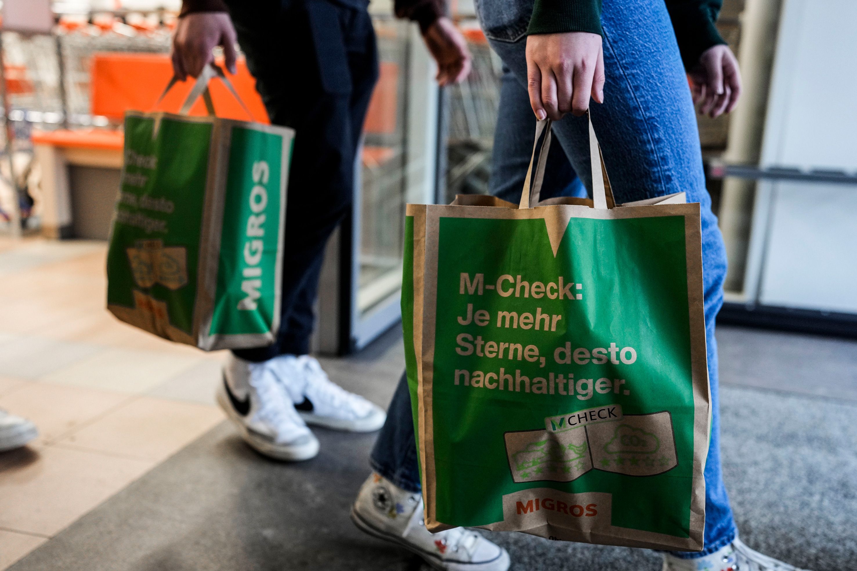 Students carrying shopping bags